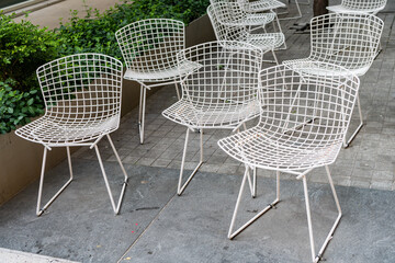 Empty chair seat outdoor. Cafe chair with nobody. Empty seat furniture. Chair or deckchair for cafe visitors