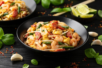 Char kway teow with rice noodles, prawn, sausages, egg and vegetables