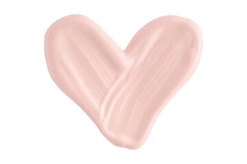 A smear of foundation cream or concealer in the shape of a heart isolated on white background,...