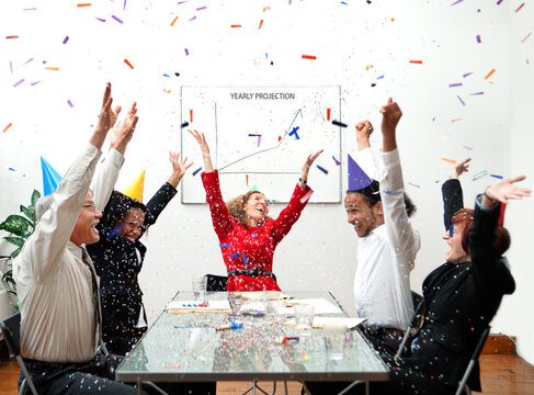Sales Are Up! A group of office workers celebrating their success. Humorous business concept.