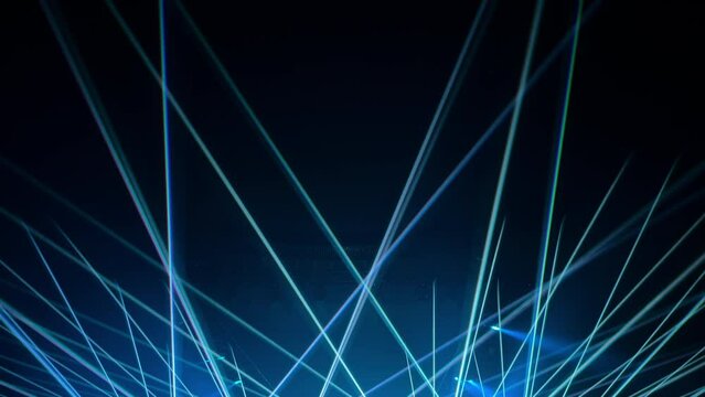 a colorful light show and a huge number of multicolored laser beams in a large indoor space