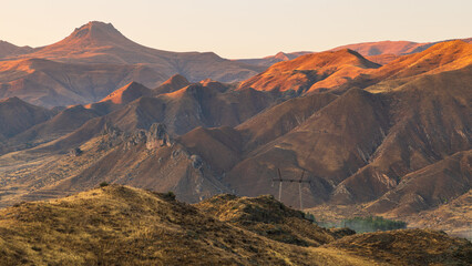 Beautiful sunset over the Caucasus mountains. Jeghenadzor, Armenia. - 705252680