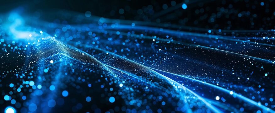 
The image shows a swirl of blue lights on a black background. great image for a website or blog background
 