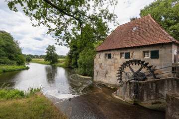 Fototapeta na wymiar Watermill on the Berkel in the hamlet of Mallem in the Dutch municipality of Berkelland near the village of Eibergen.