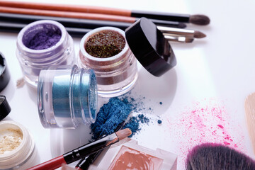 Professional cosmetics and brushes for make-up on a white background