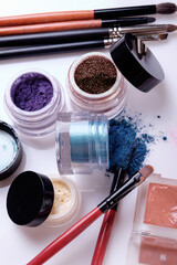 Professional cosmetics and brushes for make-up on a white background