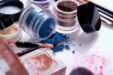 Professional cosmetics and brushes for make-up on a white background