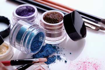 Professional cosmetics and brushes for make-up on a white background