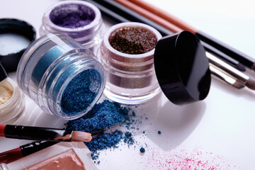 Professional cosmetics and brushes for make-up on a white background