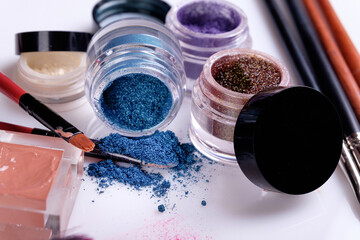 Professional cosmetics and brushes for make-up on a white background