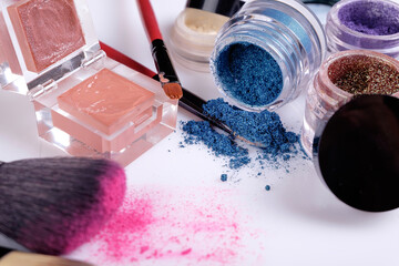 Professional cosmetics and brushes for make-up on a white background