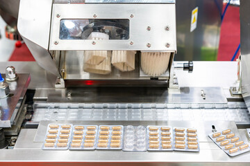 close up capsule in plastic packaging after process by automatic continuous blister packing machine in pharmaceutical or food industrial