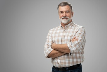 Portrait of happy casual mature man smiling, senior age man with gray hair, Isolated on gray background - Powered by Adobe