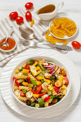 fusilli salad with mozzarella, veggies in a bowl