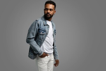 Handsome young african american guy posing in studio - isolated