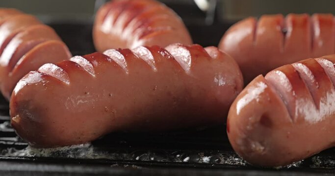 Close-up of cooking sausages in a pan