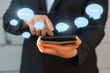 A businessman is chatting on a tablet .