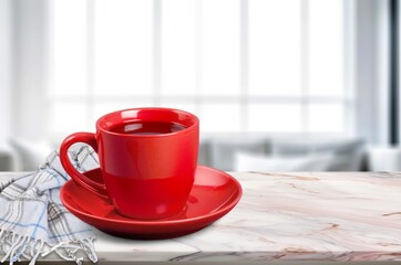 A cup of tasty hot tea on the windowsill