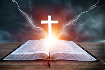 Dramatic Christian Cross light and Bible book