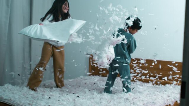 Pillow Fight Excitement - Sister Battling Small Brother, Feathers Flying in Speed Ramp Slow Motion at 1000 FPS