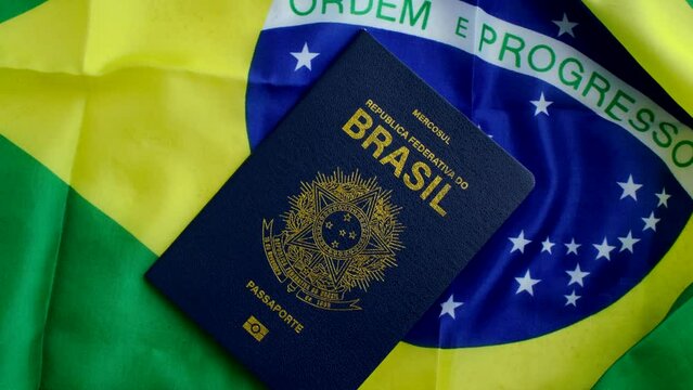 Brazilian Passport on the Flag: A symbol of national identity, the passport rests upon the vibrant flag of Brazil, evoking citizenship and pride.