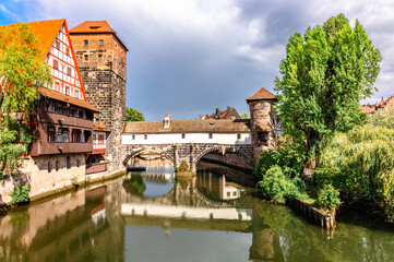 Obraz premium Colourful historic old town with half-timbered houses of Nuremberg. Bridges over Pegnitz river. Nurnberg, eastern Bavaria, Germany. High quality photo