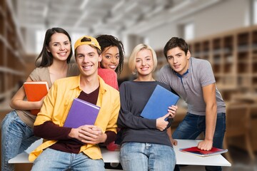 Confident group of college students sitting at classroom