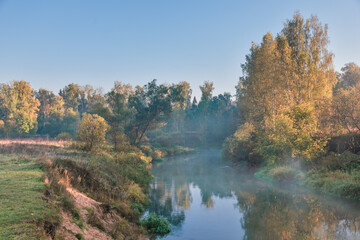 Early morning  at foggy summer river - 705275200