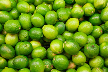 fresh ripe green lime as food background