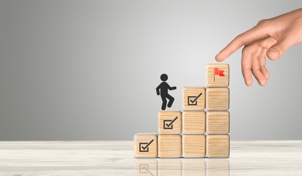 Work in progress, Goals, targets. Wooden blocks with icon.