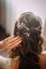 The image is of a woman getting her hair done, possibly for a wedding, as indicated by the tags...
