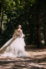 The image depicts a person wearing a wedding dress outdoors 5265.