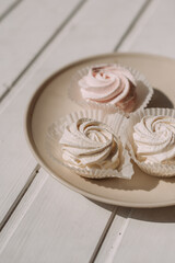 The image is a plate of dessert with a rose on the side. 5284