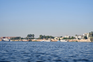 Sunset, Sand dunes on the Coastline of the Nile river part called First Cataract, Aswan, Egypt. River Nile in Egypt. Luxor, Africa.