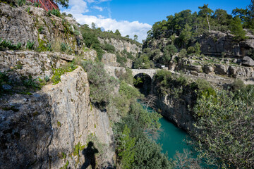 Fototapeta premium Transparent waters of Kopru River (Köprüçay, ancient Eurymedon) with its emerald green colour in Koprulu Canyon (Köprülü Kanyon) National Park, Antalya, Turkey. It's a rafting paradise