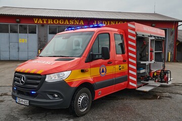 A state-of-the-art firetruck, equipped with advanced rescue technology, stands ready with its...