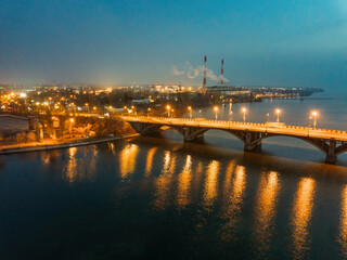Fototapeta na wymiar Evening autumn Voronezh. Sunset above Vogresovsky bridge over Voronezh river, aerial view