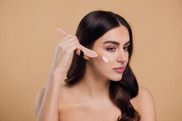 Half naked woman, face and brush cream for beauty