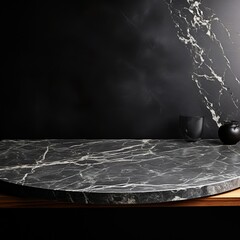 Black marble table with glass vase and ceramic jug