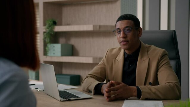 African American man businessman HR manager trader estate agent salesman consulting woman customer job interview recruitment consultation with client two business partners talk at office negotiation