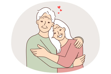 Happy elderly couple hugging