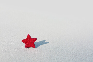 Christmas red star on Caribbean beach.