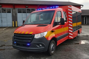 A state-of-the-art firetruck, equipped with advanced rescue technology, stands ready with its...