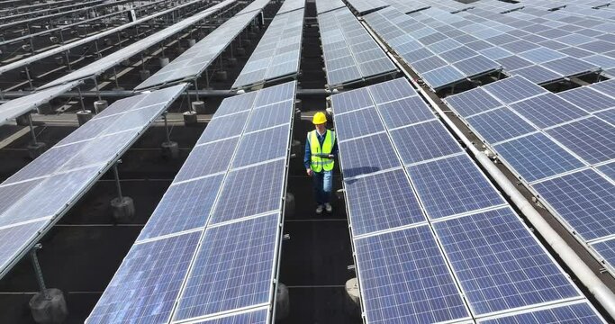 male technician works in solar power station