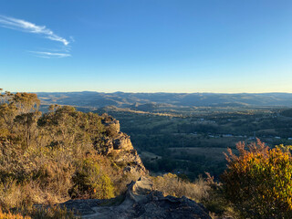 Spectacular views from a mountain-top lookout. Mountains in the horizon. Blue mountains, Australia. Grand canyon sunset. Unusual rock formation. Summit of the mountain.
