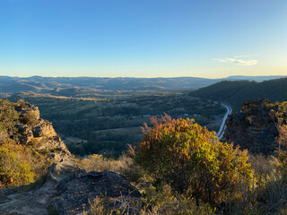 Spectacular views from a mountain-top lookout. Mountains in the horizon. Blue mountains, Australia. Grand canyon sunset. Unusual rock formation. Summit of the mountain.