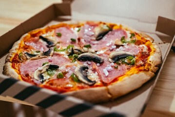Pizza Mortadella with Champignons on yeast-free dough.