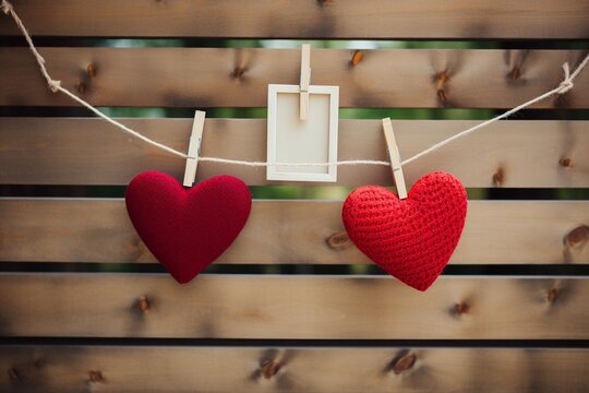 Image Love on display Red heart, two photo frames on clothesline