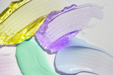 Assortment of cosmetic mask palette or cream balm isolated on beige background