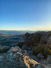 Spectacular views from a mountain-top lookout. Mountains in the horizon. Blue mountains, Australia. Grand canyon sunset. Unusual rock formation. Summit of the mountain.